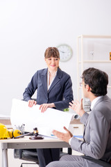 Man and woman discussing construction project