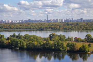 Fototapeta na wymiar NATURE AGAINST URBANIZATION, urban landscape, view across river