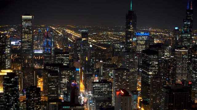 Downtown Chicago cityscape aerial view at night with focus rack