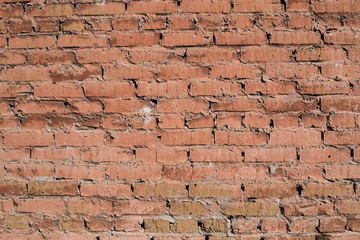 texture old, brick, uneven wall with cracks orange with cement