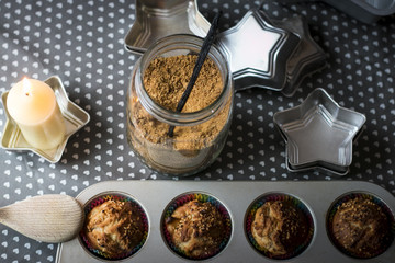 Aerial home baking themed composition with glowing candle.