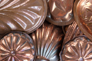 Vintage copper molds background.