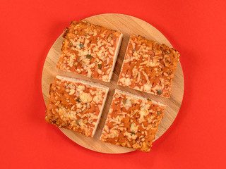 Cuttes pizza on red top view
