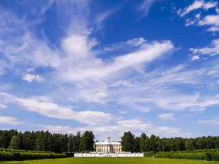 Fototapeta premium landscape with blue sky, clouns grass and white building