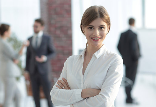 portrait of young business woman on the background of the office