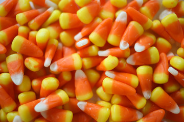 Halloween Holiday Concept, Flat Lay Pile of Candy Corn, Overhead Shot Filled Frame for Background