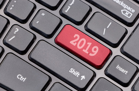 2019 on red enter key, of a black keyboard.