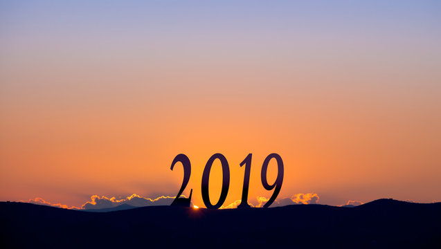 2019 On dark mountains, with vivid and beautiful sunrise as background.
