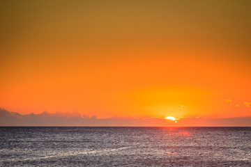 Sunset or sunrise over sea surface
