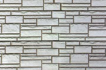 Fototapeta premium Wall of bricks of different sizes. Background with masonry texture.