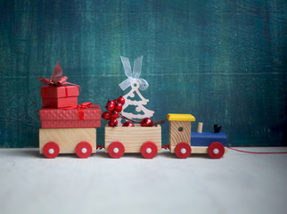 A New Year and Christmas  card/ toy train with gifts