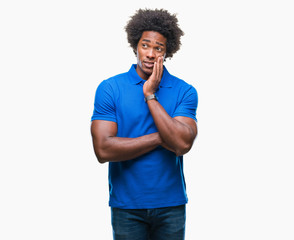 Fototapeta na wymiar Afro american man over isolated background thinking looking tired and bored with depression problems with crossed arms.