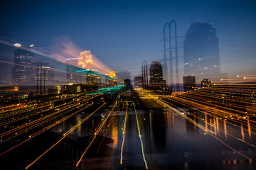 Fototapeta na wymiar Abstract cityscape view of downtown Minneapolis Minnesota in the Twin Cities area. Intentional blur, beautiful long exposure during blue hour