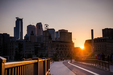 Sunset view of the Downtown Minneapolis Skyline as seen from on the Stone Arch Bridge