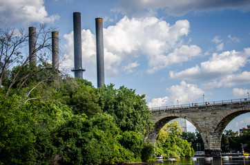 View of Minneapolis from St. Anthony Main area, features the Stone Arch Bridge and Power Plant...