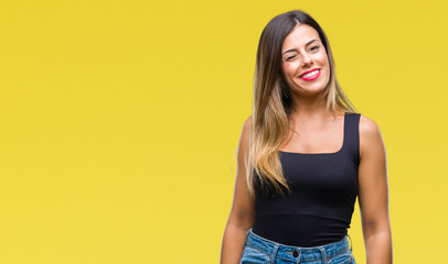 Young beautiful woman over isolated background winking looking at the camera with sexy expression,...