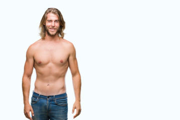 Young handsome shirtless man with long hair showing sexy body over isolated background winking looking at the camera with sexy expression, cheerful and happy face.