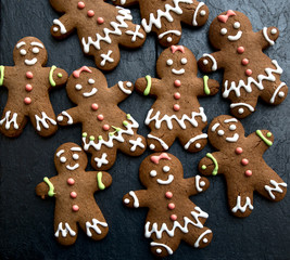 Christmas background with gingerbread menand woman.
