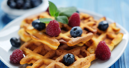 Traditional belgian waffles with fresh berrys and sugar powder  