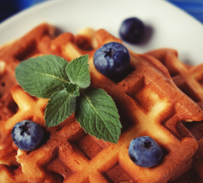 Homemade belgian waffles with fresh blueberry and raspberry