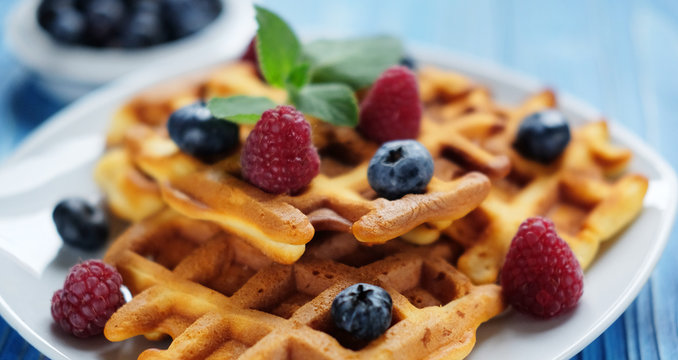 Traditional belgian waffles with fresh berrys and sugar powder  