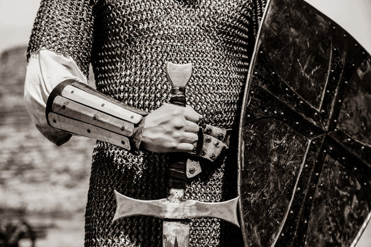 Knight man holding sword and shield. Image in black and white color style
