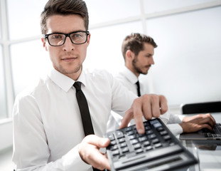 Smiling accountants discussing reports at the office