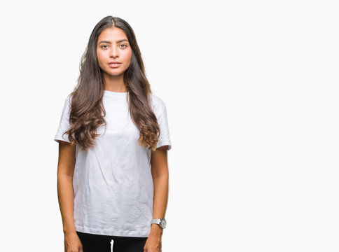 Young Beautiful Arab Woman Over Isolated Background With Serious Expression On Face. Simple And Natural Looking At The Camera.