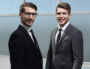 two businessmen posing