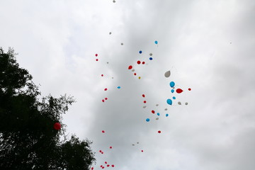 Multi-colored balloons that are released in free flight