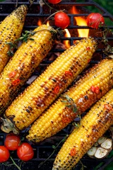 Fototapeten Grilled corn on the cob. Grilled corn on the grill plate, top view. Grilled vegetables, vegetarian food, bbq © zi3000