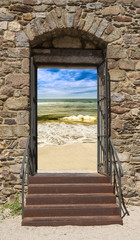 Old stone door with sea views