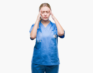 Young blonde surgeon doctor woman over isolated background with hand on head for pain in head because stress. Suffering migraine.