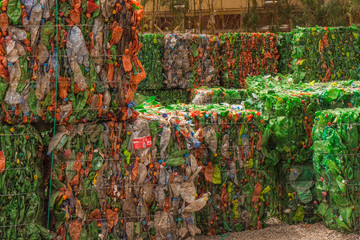 Plastic bottles crushed and packed, ready for recycling. 