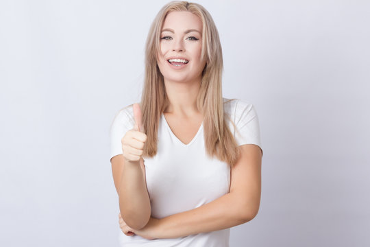Woman showing thumbs up gesture