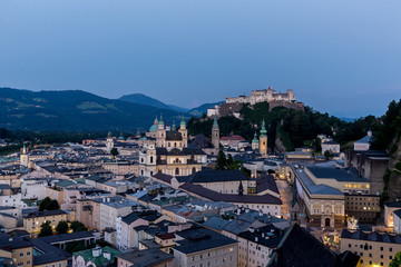 Fototapeta na wymiar Salzburg Cathedral and famous Festung Hohensalzburg illuminated in twilight