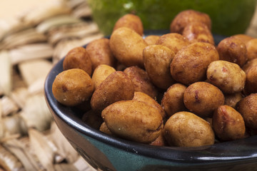 Peanuts coated full in the bowl in a bar