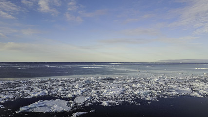 Aerial view over the ice floe edge, Lancaster Sound, northern Baffin Island, Canadian Arctic.