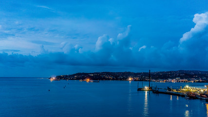 Montego Bay, Jamaica / October 2, 2018 - The lights of Montego Bay welcome another night for...