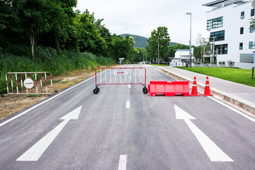 Traffic barriers on the road with arrow sign background