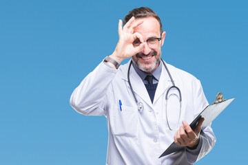 Middle age senior hoary doctor man holding clipboard over isolated background with happy face...