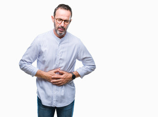 Middle age hoary senior man wearing glasses over isolated background with hand on stomach because indigestion, painful illness feeling unwell. Ache concept.