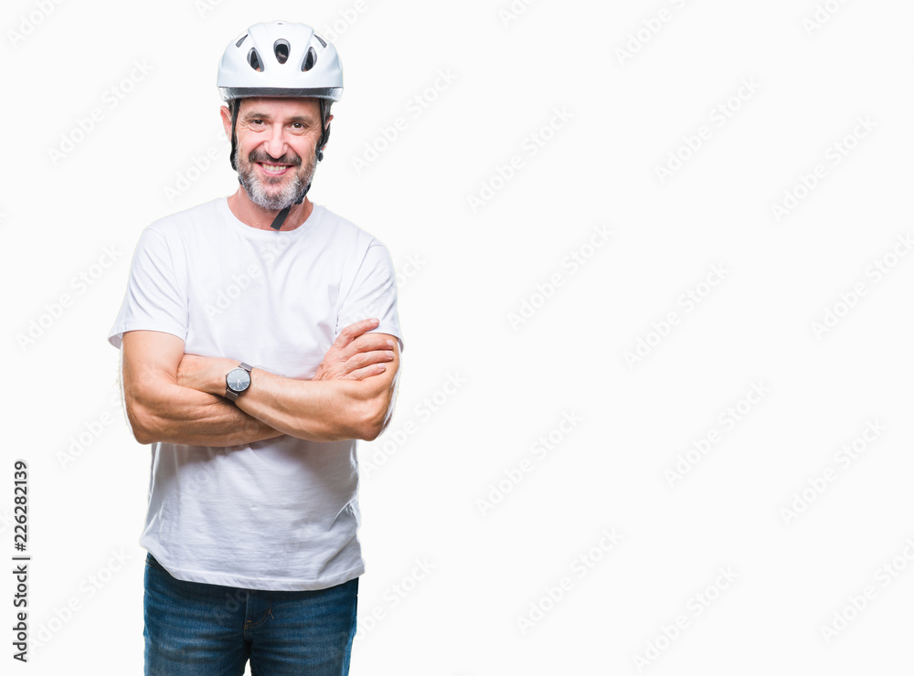 Wall mural Middle age senior hoary cyclist man wearing bike safety helment isolated background happy face smiling with crossed arms looking at the camera. Positive person.