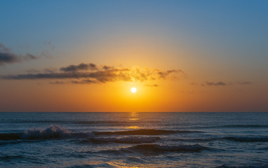 Fototapeta na wymiar Amazing colorful sunrise at sea