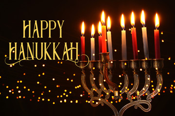 Fototapeta na wymiar image of jewish holiday Hanukkah background with menorah (traditional candelabra) and candles.