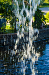 transparent falling water vertical flows, close up