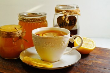 Hot tea with spices, honey and syrup - an alternative to antibiotics - selective focus
