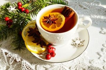 Hot tea  with spices on a wooden background. Selective focus.Still life, food and drink, seasonal and holidays concept.
