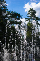 Fountain in city park on hot summer day