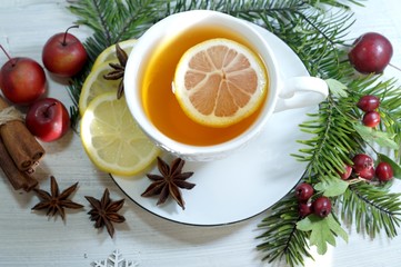 Hot tea  with spices on a wooden background. Selective focus.Still life, food and drink, seasonal...